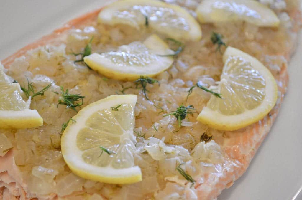 Salmon filet topped with lemon and dill
