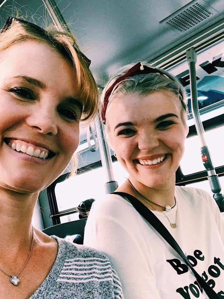 Mother and daughter smiling while on a shopping trip in Canada