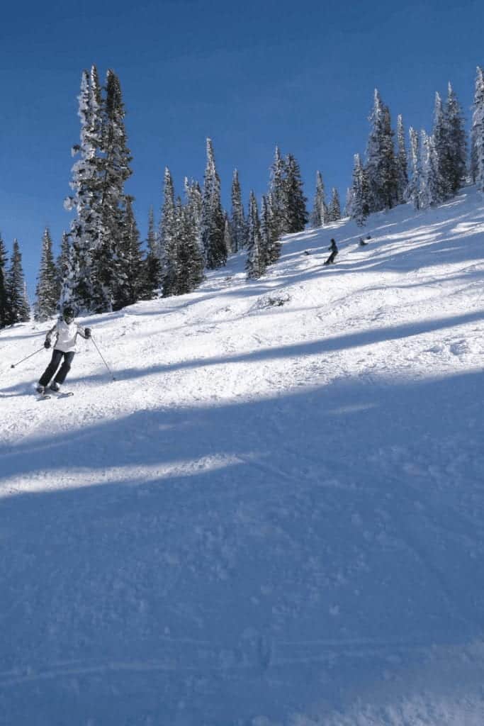 Skiier going downhill in Snowmass, Colorado.