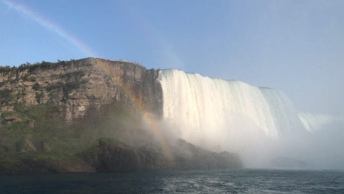 Beginning of Horseshoe Falls (US side) from Niagara Gorge with a rainbow adding the perfect touch to the scene at Niagara Falls New York.