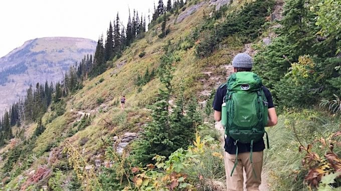 Man hiking with green backpack