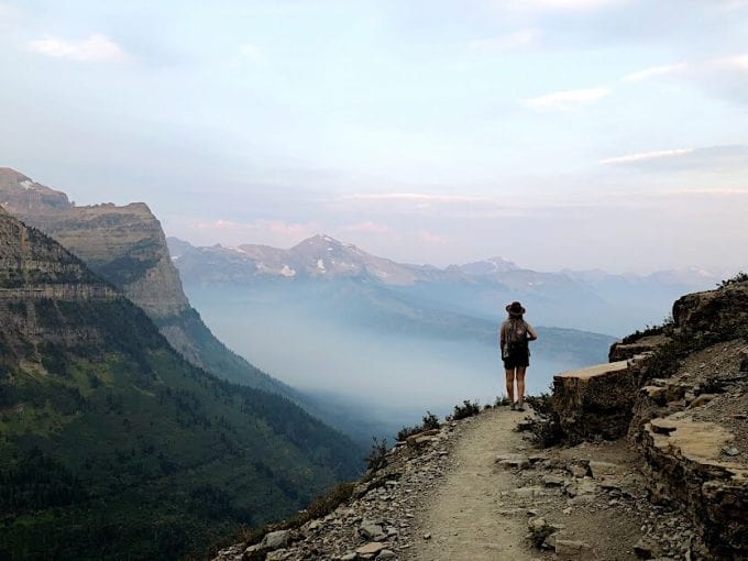 Woman hiking Highline Trail in Glacier National Park