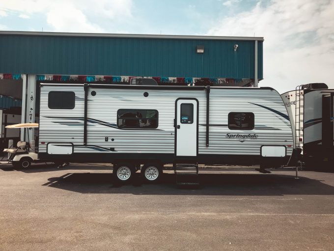 Exterior view of Keystone Springdale RV parked in the dealer lot