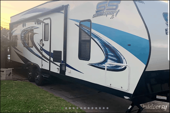 Travel trailer parked on driveway available for rent