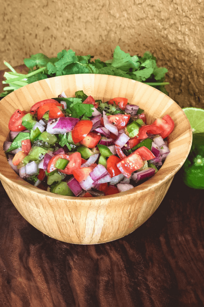 Large bowl of pico de gallo that's great with tacos made at campsite
