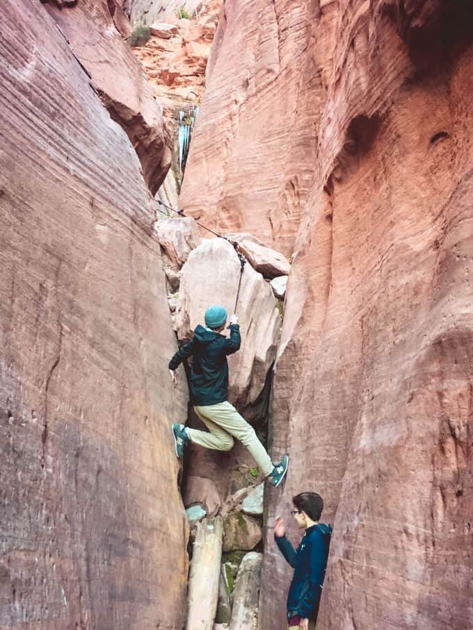 Two teenage boys hiking through Zion National Park