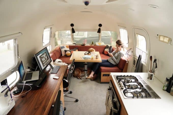Woman crafting inside an Airstream RV