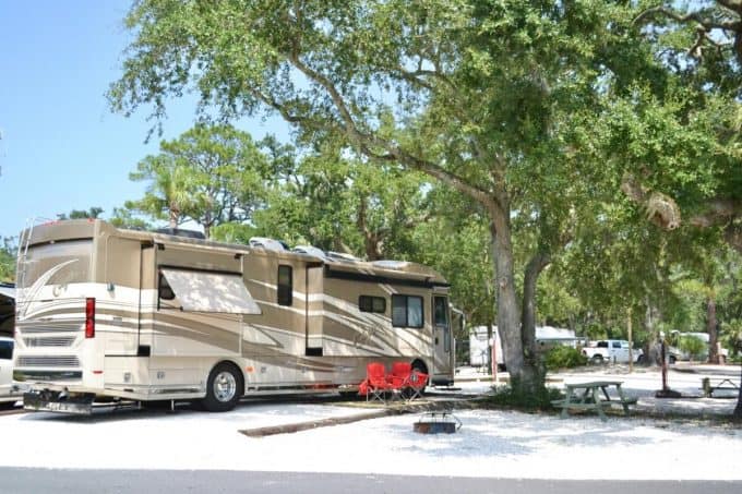Large Class A RV parked at campsite in Tybee Island Rivers End RV Park