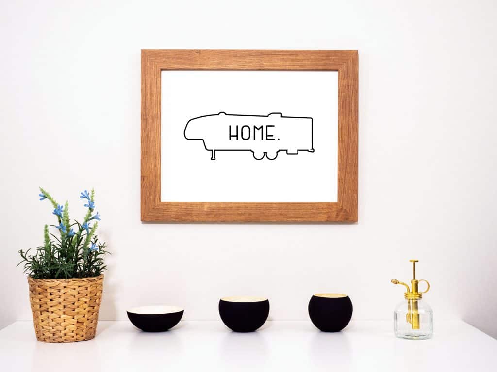 Framed art with outline of fifth wheel with the word 'Home'