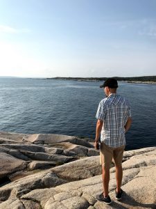 Man viewing ocean in Nova Scotia on RV trip