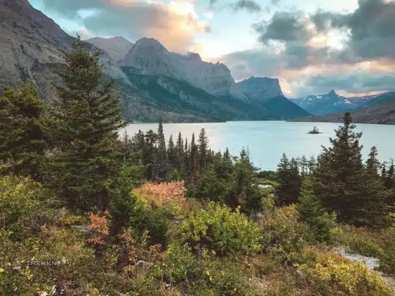 Fall colors with lake and mountains at Glacier National Park.