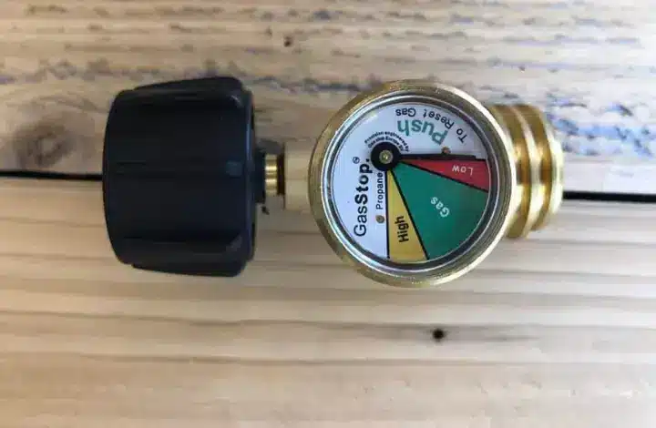 Gauge with red, yellow, green safety indicators for propane tanks.
