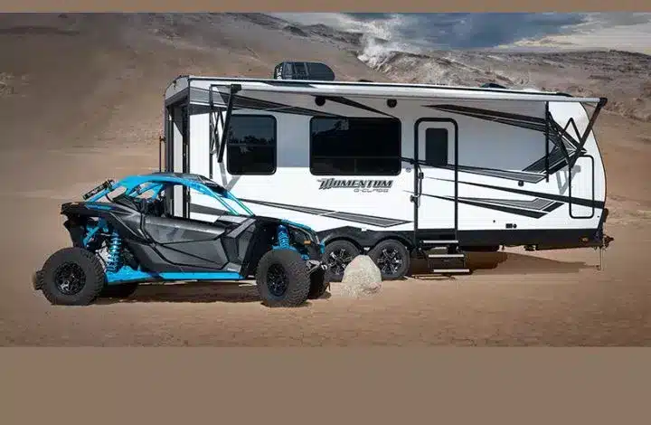 Momentum travel trailer toy hauler and blue Dune Buggy