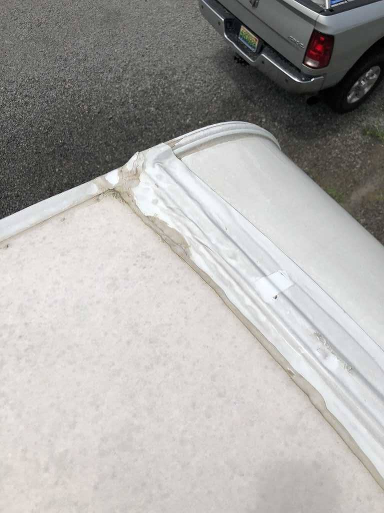 Close up view of sealant on RV roof that is cracking and needs to be repaired