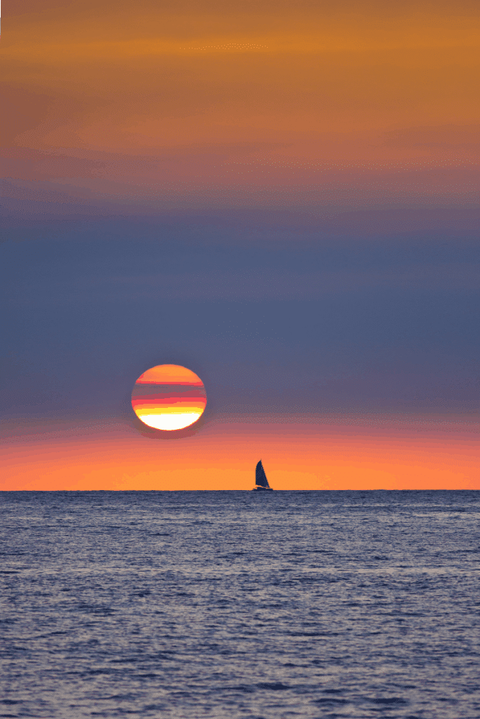 Sailboat at sunset in Kailua Kona Hawaii