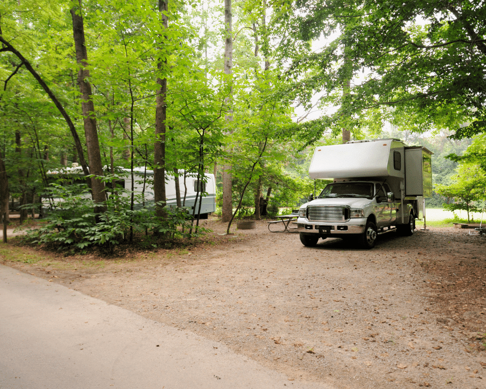 White truck camper near RV