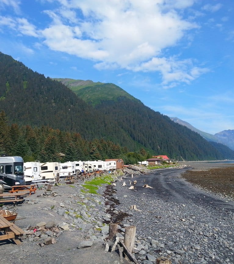 RVs parked along lake shore in Alaska