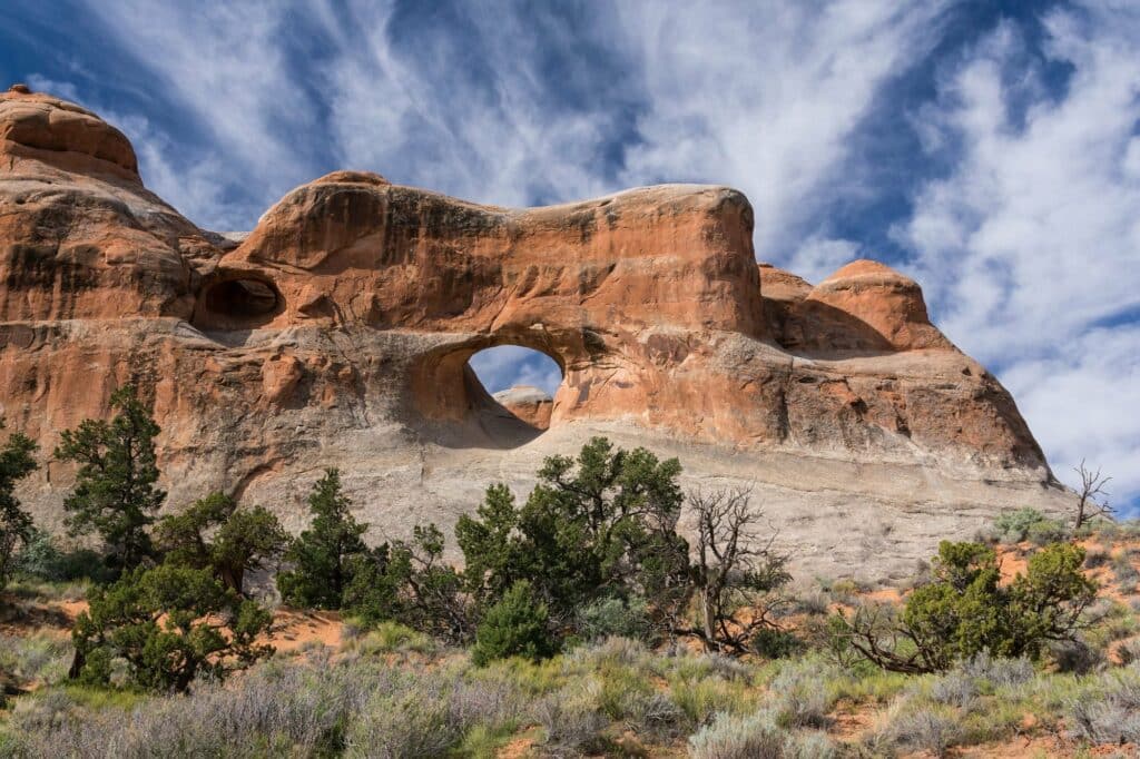 Distant view of tunnel arch in Arches National Park