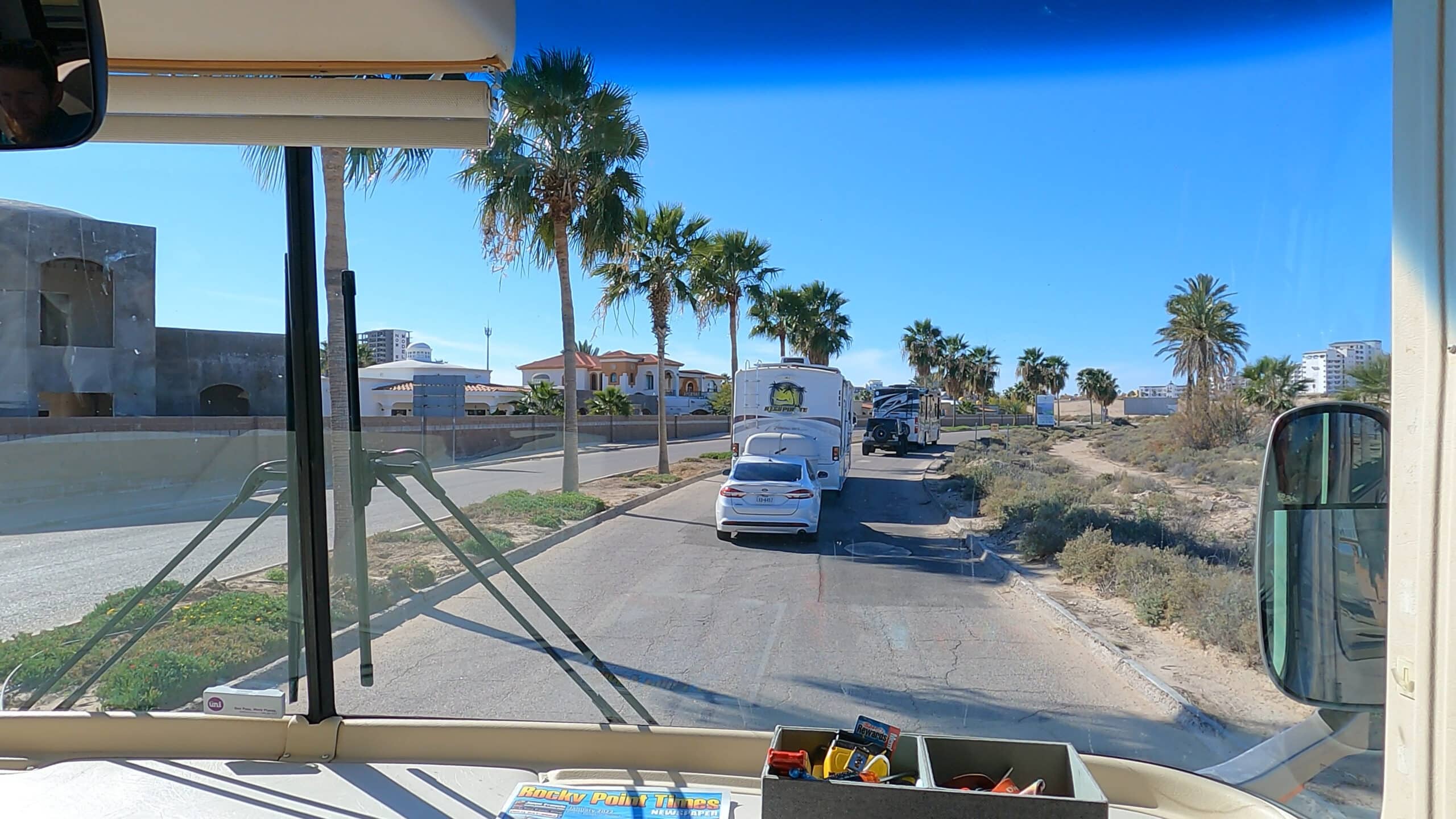 RVs driving through beach town