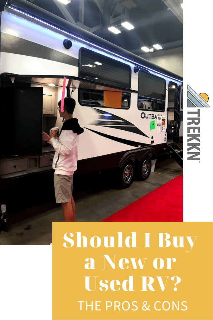 Teenage boy looking at RV to help parents decide whether to buy new or used RV.
