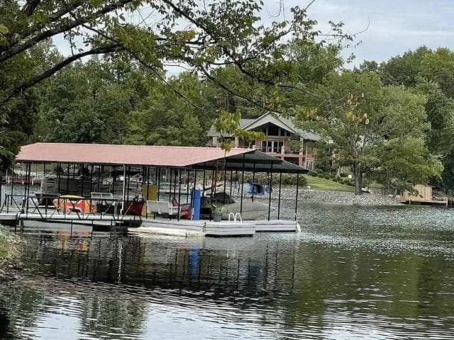 Large rental house and boat dock seen from lake
