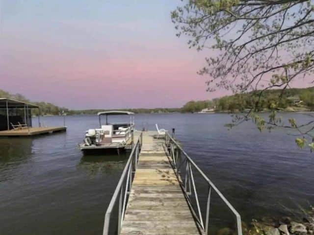 Long boat dock with pontoon at sunset