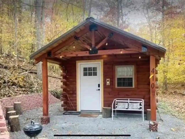 Small brown cabin with white door for rent near Shawnee National Forest