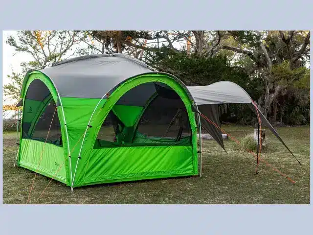 GOzeebo tent pitched at campsite with accessory awning attached.