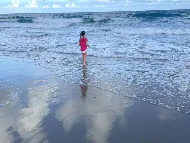 Girl in shallow surf at Boca Raton beach