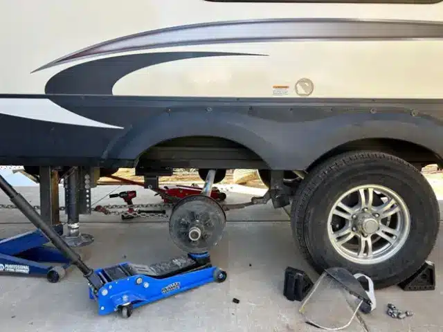 Travel trailer rear axle under repair