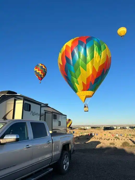 Colorful hot air balloons seen from RV boondocking area in Albuquerque